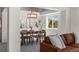 Elegant dining room featuring a stylish light fixture and mountain views at 3966 Aspen Hollow Ct, Castle Rock, CO 80104