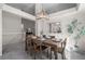 Elegant dining room featuring a stylish light fixture, table setting, and mirror at 3966 Aspen Hollow Ct, Castle Rock, CO 80104