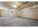 Spacious garage with an automatic door opener and a service door to the side of the house at 3966 Aspen Hollow Ct, Castle Rock, CO 80104