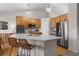 Beautiful kitchen featuring a large center island, stainless steel appliances, and modern finishes at 3966 Aspen Hollow Ct, Castle Rock, CO 80104