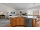 Open kitchen area with a center island, leading to the living room, and dining areas at 3966 Aspen Hollow Ct, Castle Rock, CO 80104
