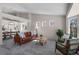 Bright living room featuring stylish furniture, large windows, and an open floor plan at 3966 Aspen Hollow Ct, Castle Rock, CO 80104
