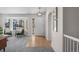 Bright living room with a bay window, stylish furniture, and inviting entry at 3966 Aspen Hollow Ct, Castle Rock, CO 80104