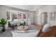 Bright living room with a bay window, stylish furniture, and an inviting entrance at 3966 Aspen Hollow Ct, Castle Rock, CO 80104