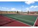The well-maintained tennis court in a community park is ready for a match under the blue sky at 3966 Aspen Hollow Ct, Castle Rock, CO 80104
