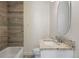 Clean bathroom with granite countertop and updated fixtures at 1901 Clinton St, Aurora, CO 80010
