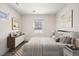Virtually staged bedroom with ample natural light at 1901 Clinton St, Aurora, CO 80010