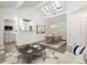 Open concept dining area with kitchen and vaulted ceiling at 1901 Clinton St, Aurora, CO 80010