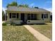 Charming single-story home with a well-maintained front yard and a walkway leading to the entrance at 1901 Clinton St, Aurora, CO 80010