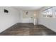 Clean and bright hallway with wood-look flooring and staircase at 1901 Clinton St, Aurora, CO 80010
