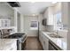 Modern kitchen with stainless steel appliances and granite countertops at 1901 Clinton St, Aurora, CO 80010