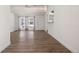Living room featuring hardwood floors and kitchen view at 1901 Clinton St, Aurora, CO 80010
