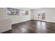 Bright living room with wood-look floors and access to balcony at 1901 Clinton St, Aurora, CO 80010