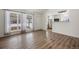 Living room with hardwood floors and updated kitchen at 1901 Clinton St, Aurora, CO 80010