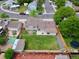 Aerial view of a fenced backyard with lush grass, a storage shed, and mature trees at 10926 Dahlia Way, Thornton, CO 80233