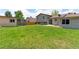 Lush backyard with a flat, green lawn, storage sheds, and secure wood fencing for privacy at 10926 Dahlia Way, Thornton, CO 80233