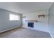 Basement Gathering room featuring a fireplace and neutral paint, with a view of an egress window at 10926 Dahlia Way, Thornton, CO 80233