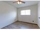 Bedroom with laminate flooring, ceiling fan, and natural light from a window at 10926 Dahlia Way, Thornton, CO 80233