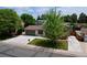 Street view of a charming home with attached garage, a large concrete driveway, and a well-manicured front lawn at 10926 Dahlia Way, Thornton, CO 80233