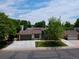 Charming home exterior with an attached garage, large driveway and a well maintained lawn and mature landscaping at 10926 Dahlia Way, Thornton, CO 80233
