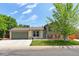 Charming split-level home featuring a well-maintained front yard and attached two-car garage at 10926 Dahlia Way, Thornton, CO 80233