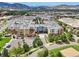 Enjoy this stunning aerial view of the community and its surrounding neighborhood with mountain views in the background at 3701 Arapahoe Ave # 106, Boulder, CO 80303