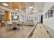 Large, open game room with a shuffleboard table and various seating options at 3701 Arapahoe Ave # 106, Boulder, CO 80303