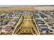 This is an aerial view of a well manicured common green area with symmetrical landscaping at 21440 E 61St Dr, Aurora, CO 80019