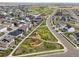 Beautiful aerial view of a neighborhood with a central park and walking paths, promoting community living at 21440 E 61St Dr, Aurora, CO 80019