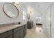 Bathroom featuring double vanity, a walk-in shower and tile floors at 21440 E 61St Dr, Aurora, CO 80019