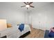 Bright bedroom featuring hardwood floors, a ceiling fan, and white walls for a clean and modern aesthetic at 21440 E 61St Dr, Aurora, CO 80019