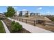 Scenic view of the community garden with raised beds and landscaping, perfect for gardening enthusiasts at 21440 E 61St Dr, Aurora, CO 80019
