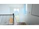 Hallway featuring staircase with railing and a large window view at 21440 E 61St Dr, Aurora, CO 80019