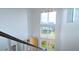Bright, multi-story entryway with large windows and modern lighting at 21440 E 61St Dr, Aurora, CO 80019