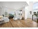 Bright living room featuring plush white sofas and large windows at 21440 E 61St Dr, Aurora, CO 80019