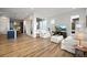 Open living space with large windows bringing in natural light and views to the kitchen at 21440 E 61St Dr, Aurora, CO 80019