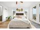 Main bedroom featuring natural light and a door to a balcony at 21440 E 61St Dr, Aurora, CO 80019