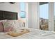 Relaxing main bedroom with balcony access and a tray with decorative pieces at 21440 E 61St Dr, Aurora, CO 80019