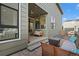 Covered patio with outdoor seating, string lights, and access to backyard at 21440 E 61St Dr, Aurora, CO 80019