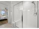 Modern bathroom featuring a glass-enclosed shower and a built-in bench at 21440 E 61St Dr, Aurora, CO 80019