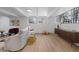 Spacious basement features light wood floors and large windows, providing plenty of natural light at 10801 W 29Th Ave, Lakewood, CO 80215