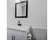 Modern bathroom features new fixtures, a white vanity, and plenty of storage for toiletries at 10801 W 29Th Ave, Lakewood, CO 80215
