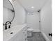 Modern bathroom with gray floor tiles, white wall tiles and new vanity at 10801 W 29Th Ave, Lakewood, CO 80215