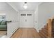 Bright entryway boasts a double-door entry, wood floors and a staircase to the upper level at 10801 W 29Th Ave, Lakewood, CO 80215