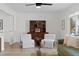 Cozy living room featuring hardwood floors, a comfortable green sofa, and stylish decor at 10801 W 29Th Ave, Lakewood, CO 80215
