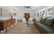 Bright living room with hardwood floors, large window, comfortable seating, and tasteful decor at 10801 W 29Th Ave, Lakewood, CO 80215