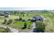 Aerial view of the large property with landscaped backyard and white fencing at 6051 E 160Th Pl, Brighton, CO 80602
