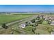 Aerial view showcases property with a large fenced backyard, close to open land at 6051 E 160Th Pl, Brighton, CO 80602