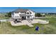 Expansive backyard featuring a stone patio with a pergola, basketball hoop and room to entertain at 6051 E 160Th Pl, Brighton, CO 80602