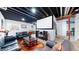 Finished basement features theater area with projector screen, seating, and speakers at 6051 E 160Th Pl, Brighton, CO 80602